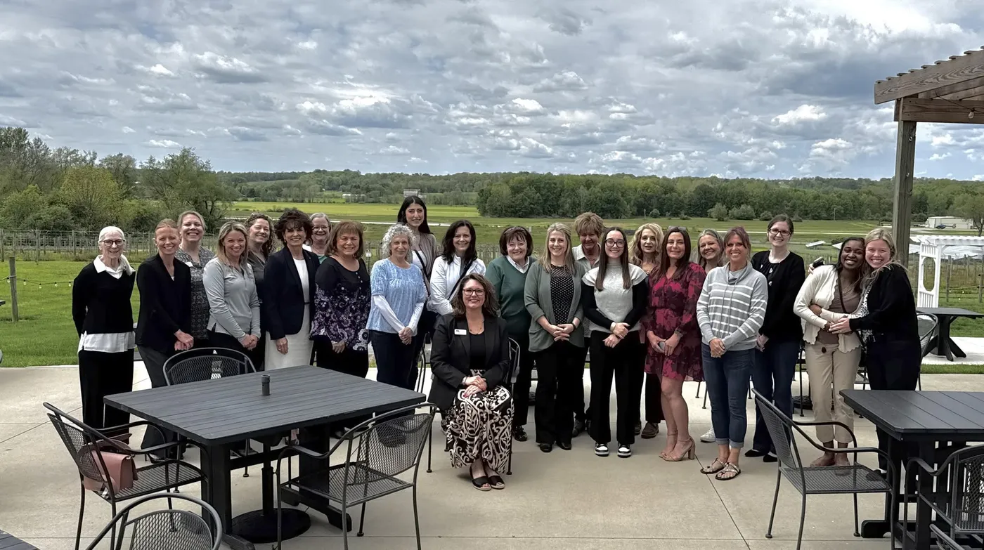 Members gathered on a patio at a Chamber luncheon